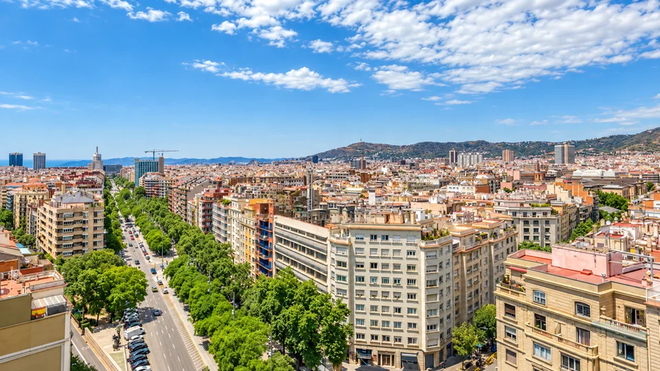 Orthogonal Eixample city blocks and Mediterranean city skyline