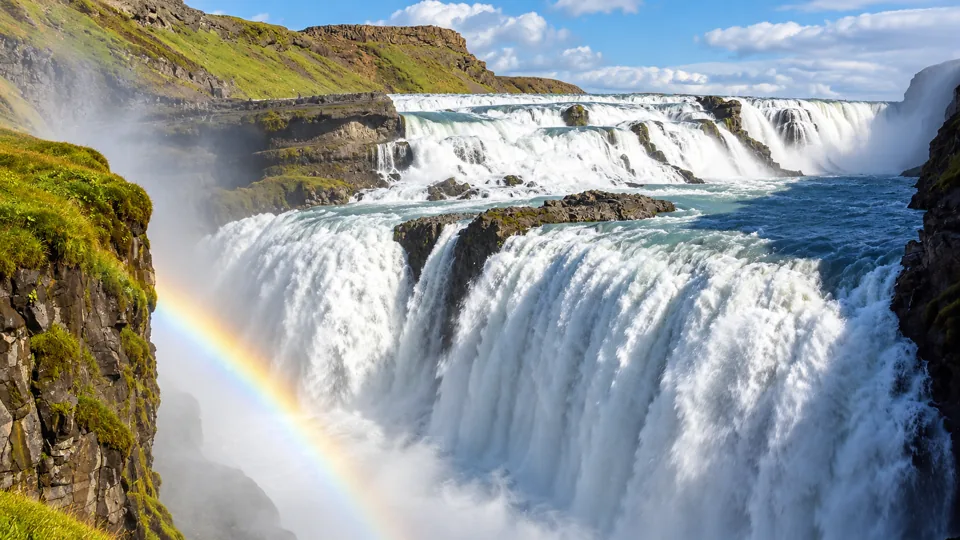 Two tier Gullfoss waterfall flowing into deep canyon