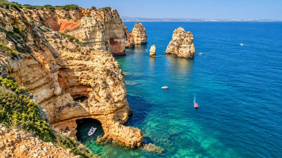 Ponta da Piedade limestone sea stacks and blue water