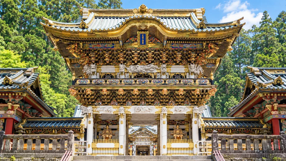 Yomeimon gate with white gold detailing in forest