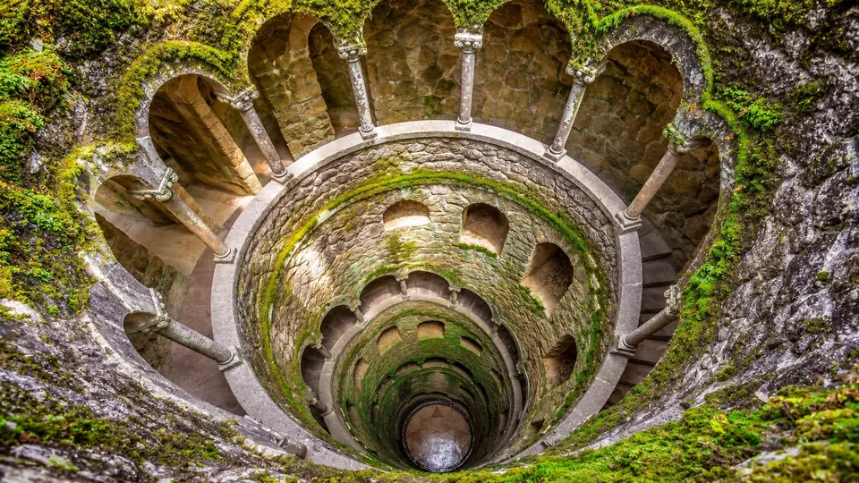 Real spiral stone stair around the deep Initiation Well