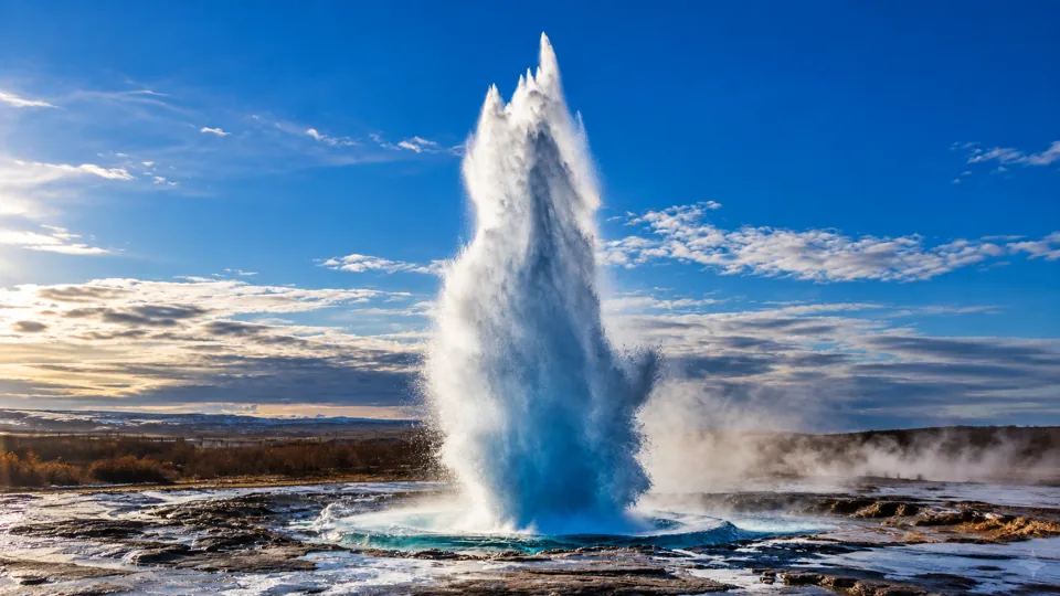 Strokkur white water plume over geothermal field