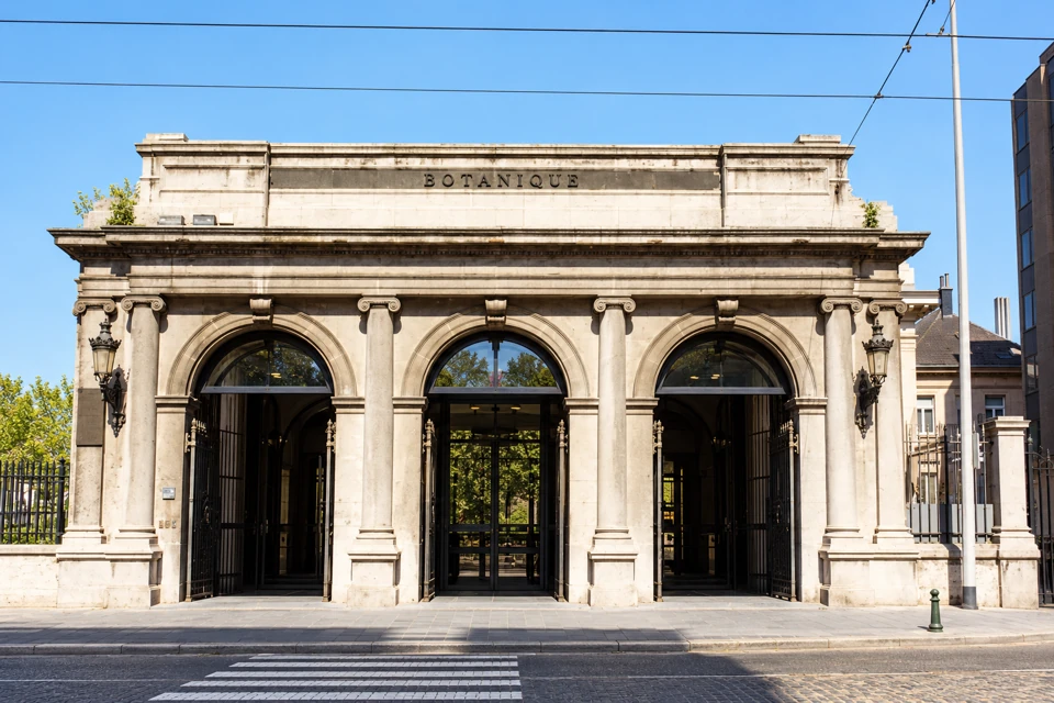 Botanique's pale stone entrance portico in Brussels, with three rounded arches.
