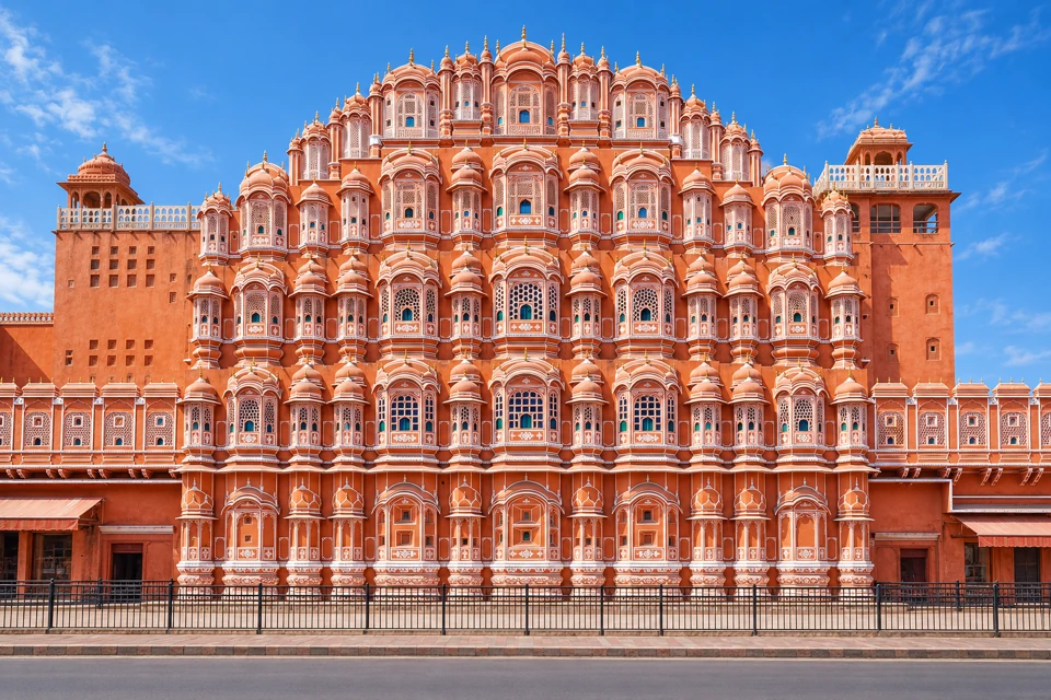 The five-tier pink sandstone facade of Hawa Mahal in Jaipur.