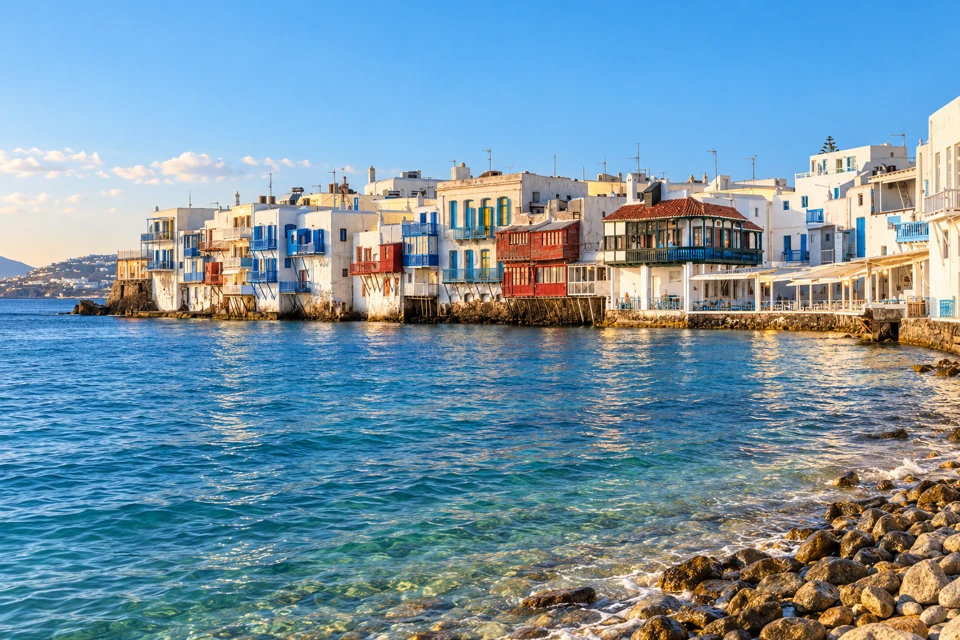 Little Venice's white seafront houses and projecting red and blue wooden balconies in Mykonos Town