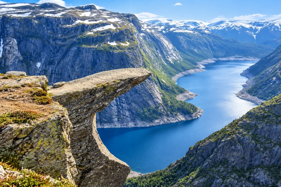 The layered Trolltunga rock ledge above Lake Ringedalsvatnet and steep mountain walls.