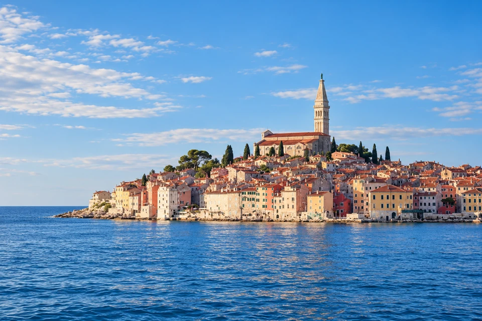 Rovinj's dense waterfront houses rise to St Euphemia's church and slender bell tower above the Adriatic.