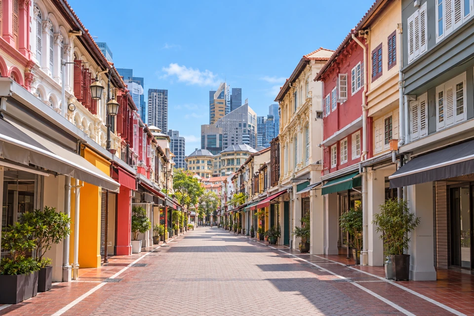 Pastel heritage shophouses with timber shutters along Pagoda Street in Singapore Chinatown