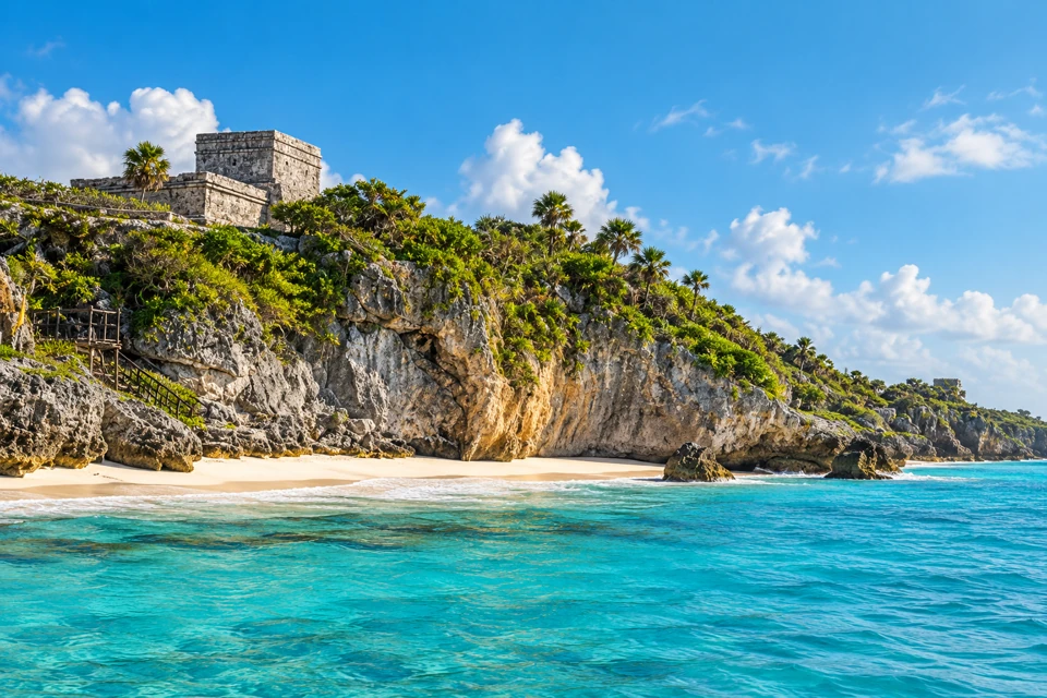 El Castillo above Tulum's limestone coastal bluff, pale sand and turquoise Caribbean water