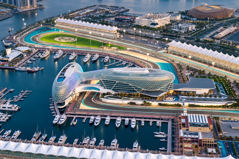 Yas Marina's waterfront, hotel lattice canopy, empty grandstands and circuit on Yas Island in Abu Dhabi.